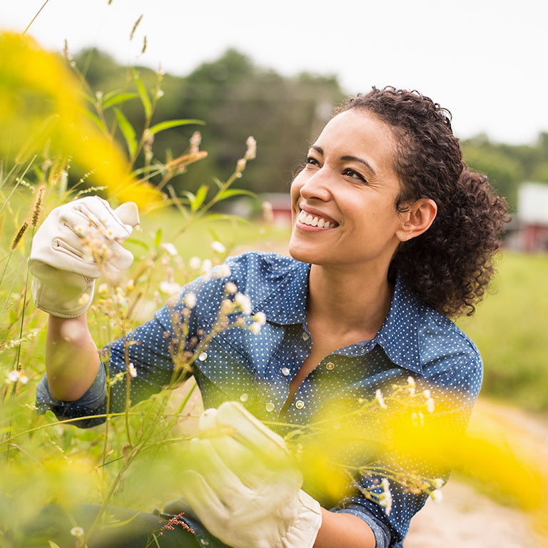 Woman with allergies does some gardening